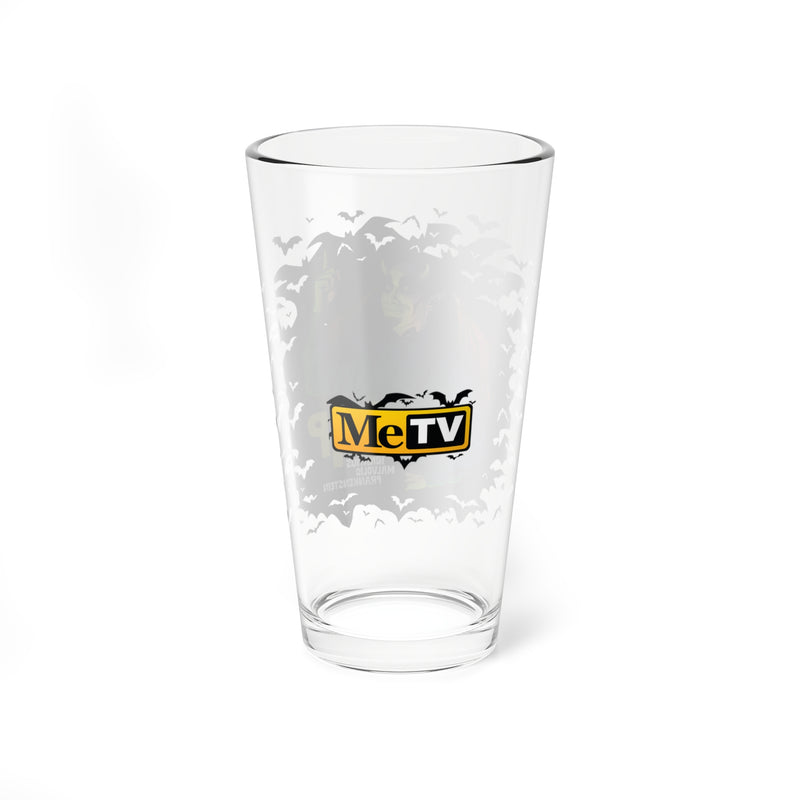 Back of the clear IMP pint glass showing a centered MeTV logo with the text 'MeTV' in black and yellow