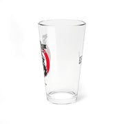 Left side view of the Svengoolie pint glass showing the face logo in a red circle, with faint text on the opposite side.