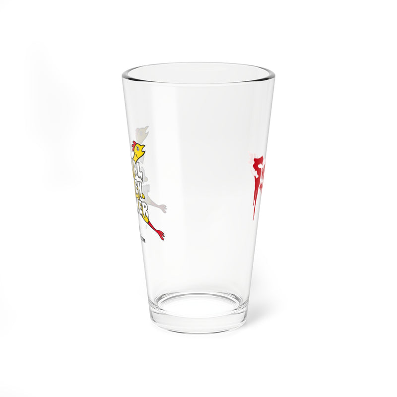 Side view of the clear pint glass showing part of the white and yellow chicken graphic on the left and a red Svengoolie splatter logo on the right.