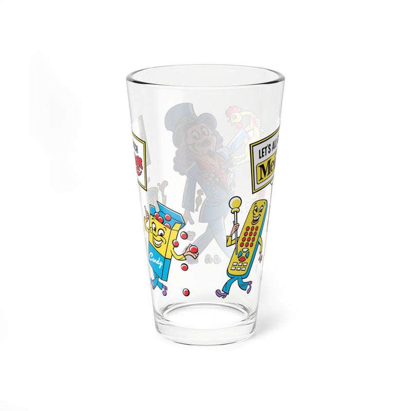 Opposite side of Svengoolie pint glass showing a candy box character beside a remote control character holding a 'LET'S ALL GO TO MeTV' sign.