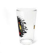 Side view of the clear pint glass showing the rooster and bats of the Svengoolie design, with the MeTV logo on the opposite side.