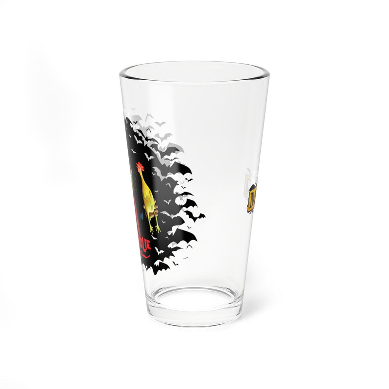 Side view of the clear pint glass showing the rooster and bats of the Svengoolie design, with the MeTV logo on the opposite side.