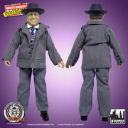 Front and back views of the Joe Besser action figure out of packaging, showing its gray pinstripe suit and black fedora from both sides.