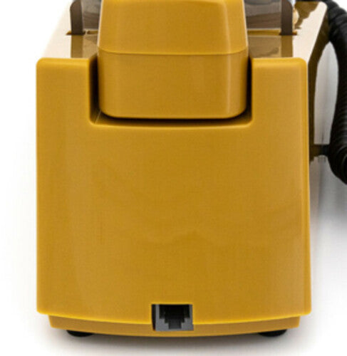 Back of the mustard phone showing a gray telephone line jack on the base beneath the handset rest