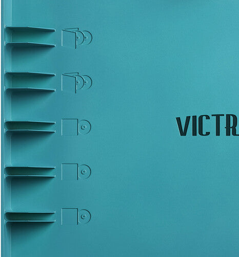 Close-up of the blue lid showing five record storage slots and part of the 'VICTROLA' text in black.