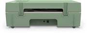 Rear view of basil green record player showing two round ports on the back panel and a cutout in the base.