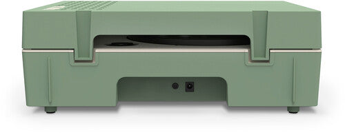 Rear view of basil green record player showing two round ports on the back panel and a cutout in the base.