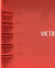 Close-up of the red lid interior showing the raised record storage shelves and partly cropped white lettering from the text 'VICTROLA'.