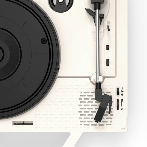 Close-up of the white control panel and silver tonearm of the red record player, with black buttons and a black vinyl record on the platter.