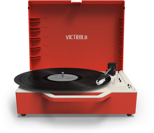 Front view of the open red record player with a black vinyl record on the platter and the text 'VICTROLA' in white on the inside of the lid.