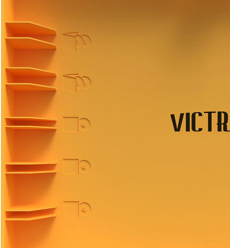Close-up of the orange lid interior with embossed record shelves and the partial word 'VICTR' in black, part of the Victrola logo.