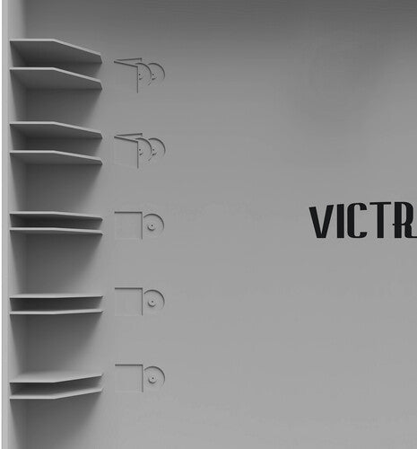 Inside gray lid of record player with five record shelves on the left and partially visible text 'VICTR' in black
