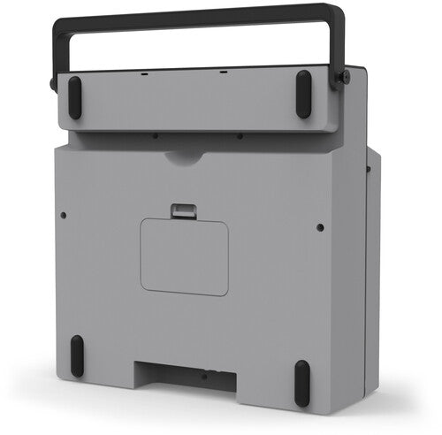Back of gray portable record player showing black carrying handle and a small rectangular access panel on the rear