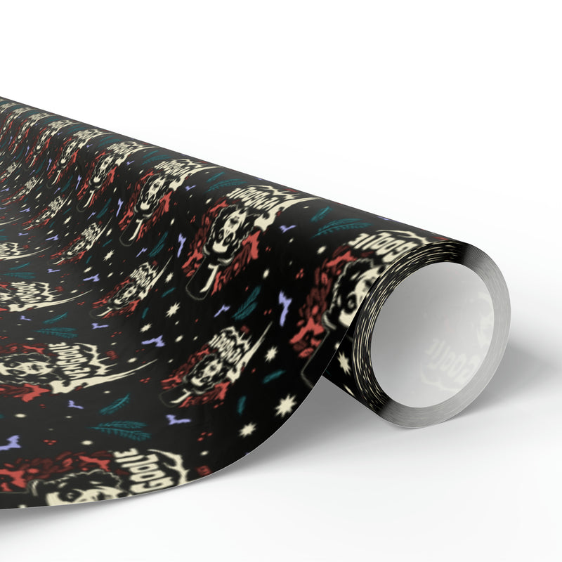 Rolled end of Svengoolie wrapping paper showing the repeating face logo pattern in cream, red, and teal on black.