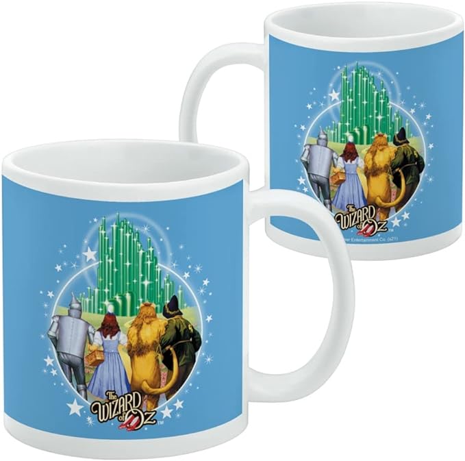 Two blue mugs side by side, one front-facing and one turned to show the same Emerald City design from the side with a small copyright line.