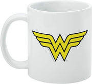 Front of the white Wonder Woman mug with the handle on the left, showing the yellow logo and a small copyright line below it.