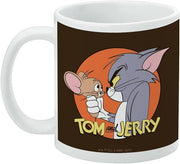 Left side of the mug showing the Tom and Jerry design with the text 'TOM and JERRY' in yellow and a small copyright notice at the bottom.