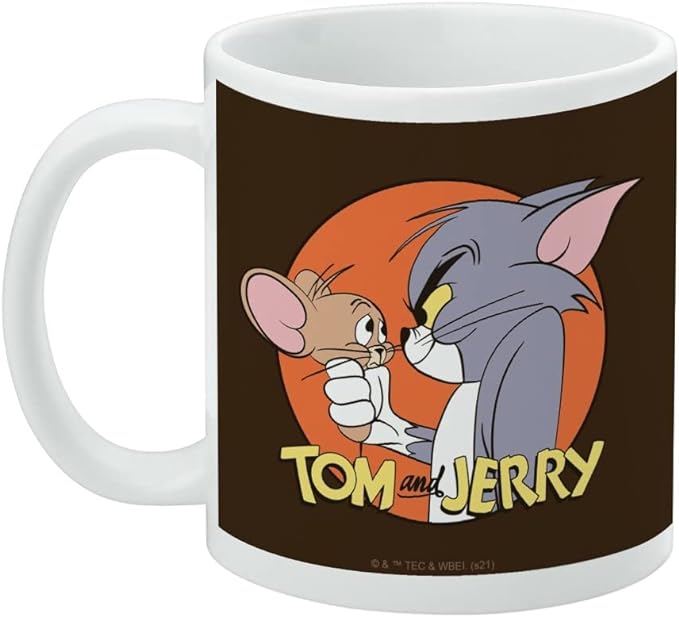 Left side of the mug showing the Tom and Jerry design with the text 'TOM and JERRY' in yellow and a small copyright notice at the bottom.