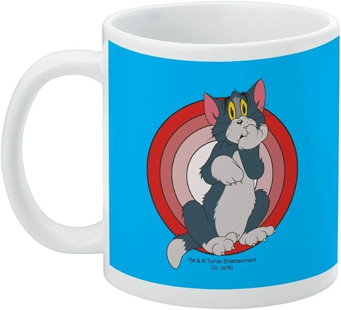 Blue Tom mug turned to show the handle on the left, with a small copyright line below the cartoon Tom design.