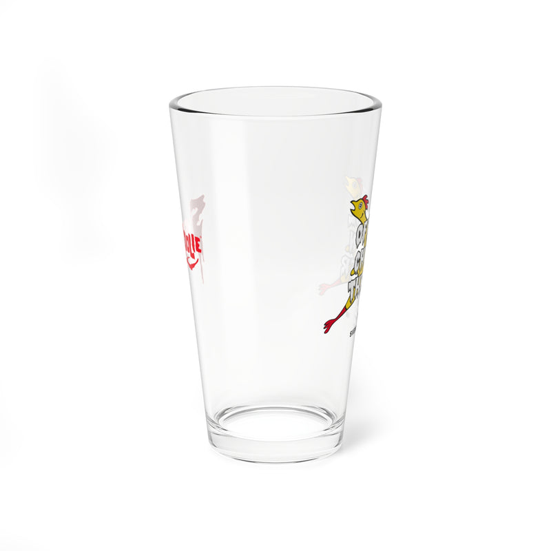 Other side view of the Svengoolie pint glass showing a red Svengoolie logo on the left and a yellow chicken beside partial white lettering on the right.