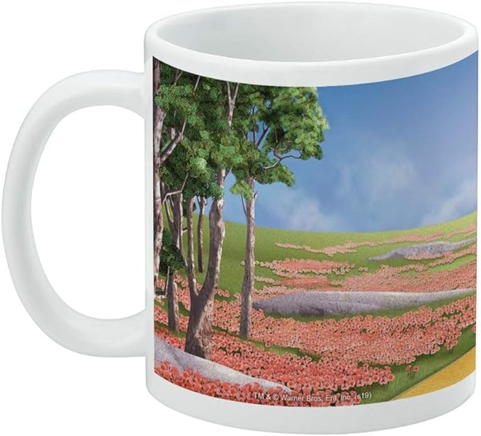 Left side of the Wizard of Oz Dorothy mug showing a grove of trees and a pink poppy field rolling toward the Yellow Brick Road.