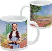 Side-by-side view of the Dorothy mug showing Dorothy on the front and a poppy field with trees and the Yellow Brick Road on the opposite side.
