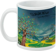 Back of white Wicked Witch mug with black handwritten 'Surrender Dorothy' above a yellow brick road and apple tree