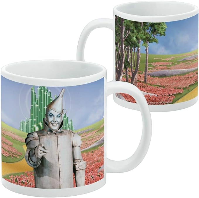 Front and side views of the white Tin Man mug, with the wrap showing a tree-lined poppy field and a yellow brick road beside the handle.