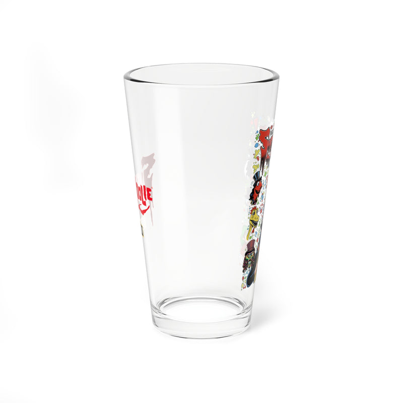Side view of the clear pint glass showing the red dripping 'Svengoolie' logo on the left and the Sveniverse characters on the right.