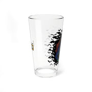 Opposite side of the clear IMP pint glass showing a partial yellow and black MeTV logo on the left, with bats and part of the IMP character on the right.