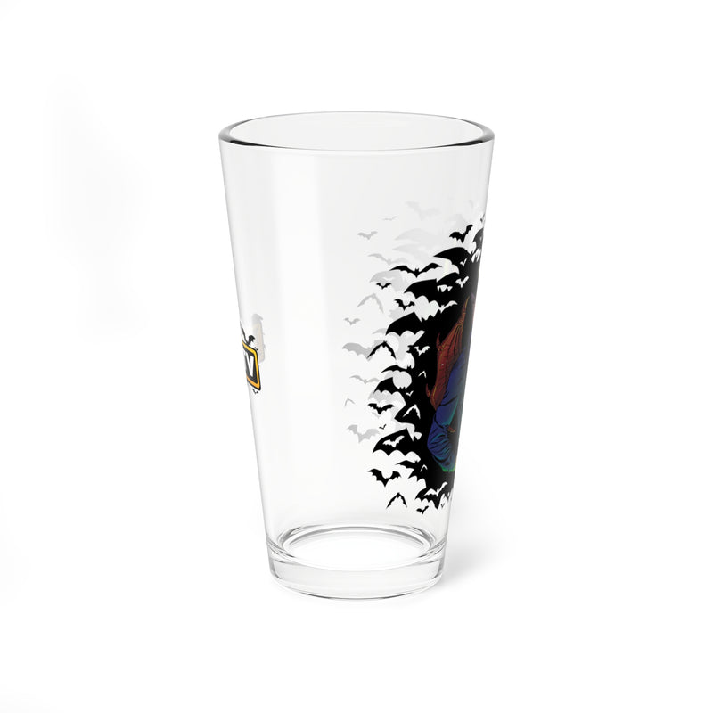 Opposite side of the clear IMP pint glass showing a partial yellow and black MeTV logo on the left, with bats and part of the IMP character on the right.