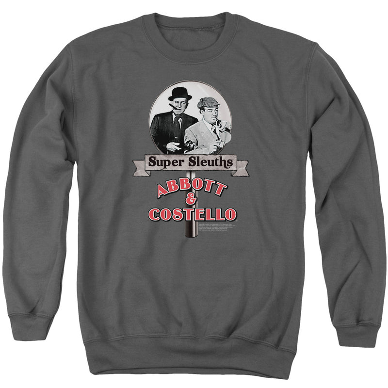 Charcoal gray crewneck sweatshirt with a magnifying glass graphic showing two vintage men, with the text 'Super Sleuths' on a banner above 'ABBOTT & COSTELLO' in red.