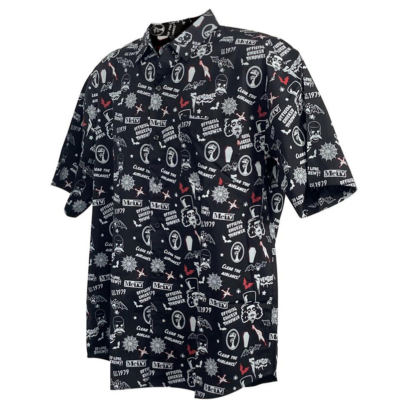 3/4 view of black short-sleeved button-up shirt with an all-over Svengoolie print of faces, bats, coffins, and 'MeTV' logo in white.