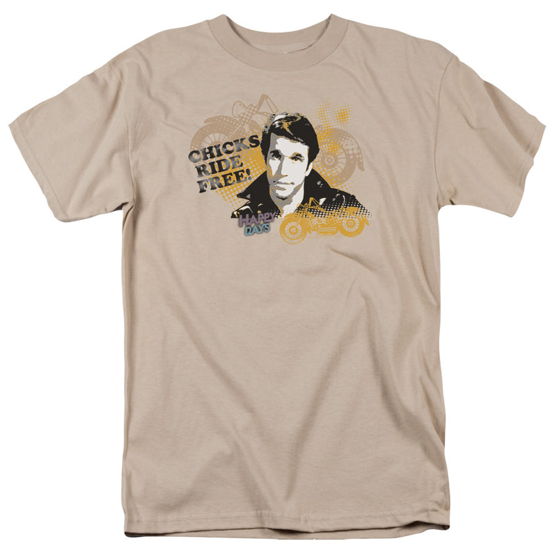 Sand short-sleeved t-shirt featuring a portrait of a man in a leather jacket with the text 'CHICKS RIDE FREE!' in black.