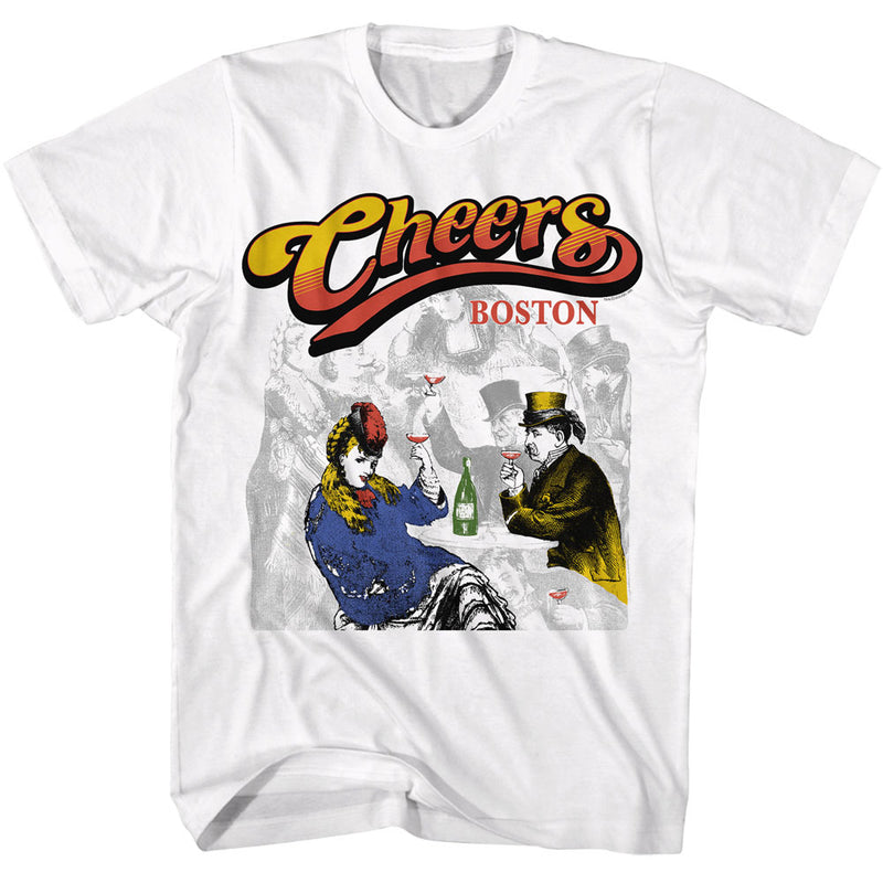 White t-shirt featuring a vintage illustration of a couple toasting wine glasses, with the text 'Cheers' in yellow and red above 'BOSTON'.