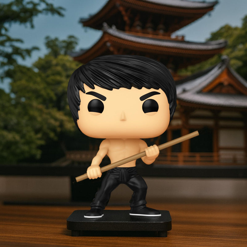 Lifestyle shot of the Bruce Lee Funko Pop figure on a black base in front of a pagoda, with the staff held diagonally across its body