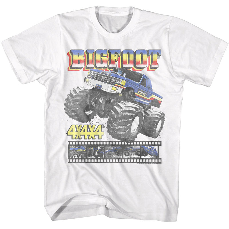 White short-sleeved t-shirt featuring a blue Bigfoot monster truck with the text 'BIGFOOT' in red and yellow above it.