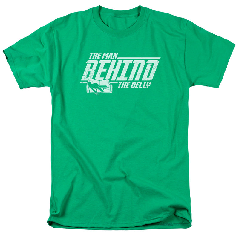 Kelly green short-sleeved t-shirt with a white distressed graphic of a figure on a couch and the text 'THE MAN BEHIND THE BELLY' in white.
