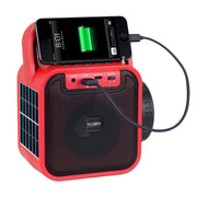 Red Jensen portable radio speaker charging a smartphone resting on top through a USB cable plugged into the front control panel.
