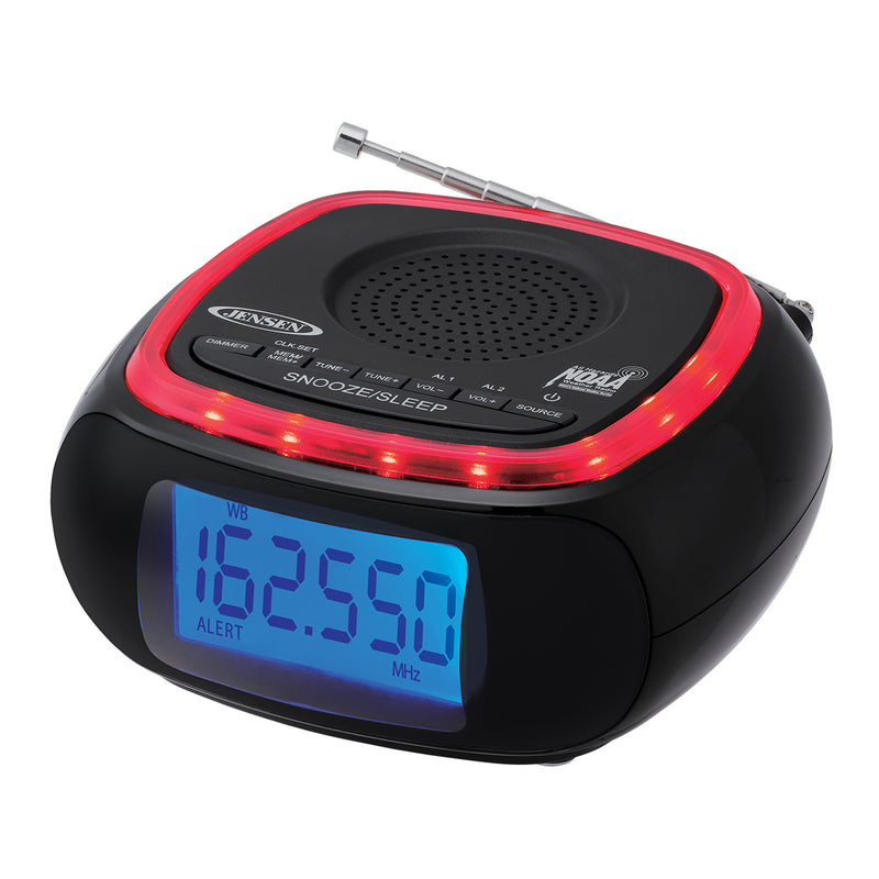 Angled view of Jensen clock radio showing the blue display set to weather band 162.550 MHz with the ALERT indicator lit.
