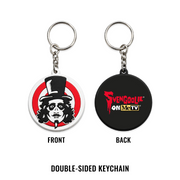 Double-sided keychain shown front and back on a white background. The front side features a Svengoolie target face logo, and the back side is black with red and yellow 'Svengoolie on MeTV' text.