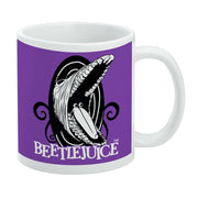 Purple and white ceramic mug featuring a black-and-white open-mouthed monster with swirling tendrils and the text 'BEETLEJUICE' in white below it.