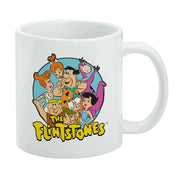 White mug featuring a circular group portrait of The Flintstones characters with the text 'The Flintstones' in yellow below it.