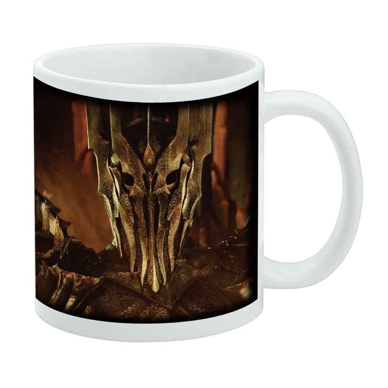 White mug featuring a dark wraparound print of Sauron's spiked, bronze helmet with hollow eyes from The Lord of the Rings Trilogy.