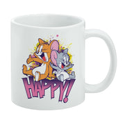 White mug featuring Tom and Jerry sitting together against yellow and purple paint splashes, with the text 'HAPPY!' in pink below them.