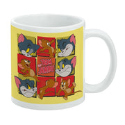 White mug with yellow band featuring Tom and Jerry faces in a grid of red squares with the text 'Tom and Jerry' in pink in the center.