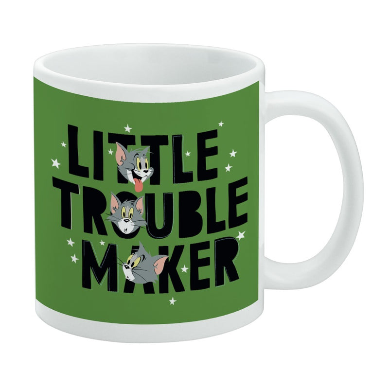 Angled view of green ceramic mug featuring three Tom cat faces stacked above the text 'Little Trouble Maker' in black lettering.