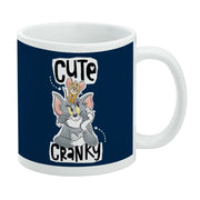 Navy ceramic mug featuring Tom and Jerry with Jerry perched on Tom's head, with the text 'Cute' above and 'Cranky' below in black.