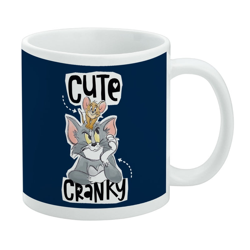 Navy ceramic mug featuring Tom and Jerry with Jerry perched on Tom's head, with the text 'Cute' above and 'Cranky' below in black.