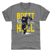 Gray t-shirt featuring a cartoon of Brett Hull in a blue and yellow hockey jersey with the text 'BRETT HULL' and the St. Louis skyline in yellow.